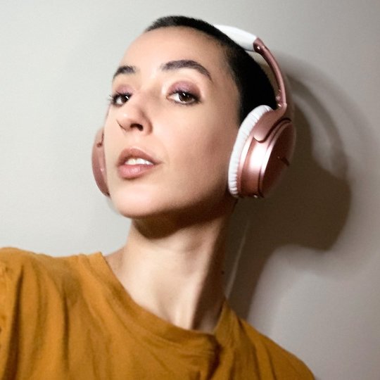 italian-american autistic artist with headphones on